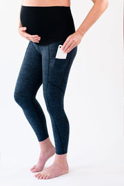 Our over-the-belly maternity leggings with pockets gives bump coverage and extra- support for working out in comfortable stretch fabric in space gray.