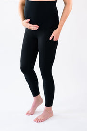 Our over-the-belly maternity leggings with pockets gives bump coverage and extra- support for working out in comfortable stretch fabric in black.