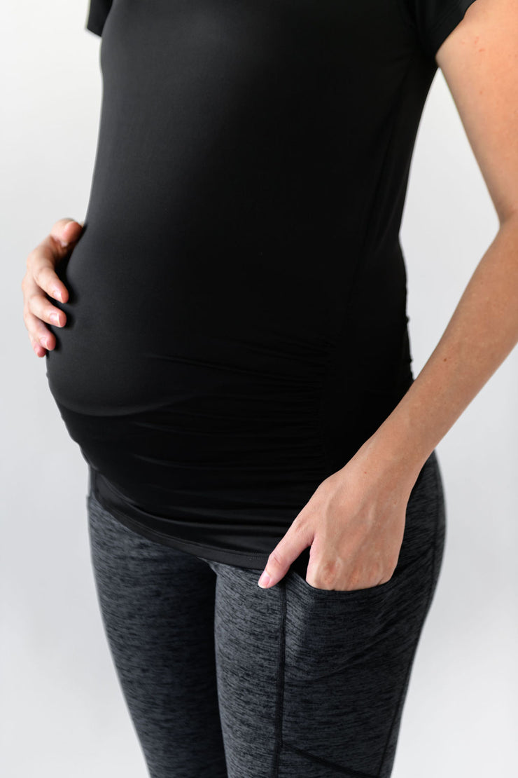 Our Donna v-neck maternity tee-shirt with ruching is perfect throughout pregnancy with its soft flattering cut and moisture wicking fabric in black.