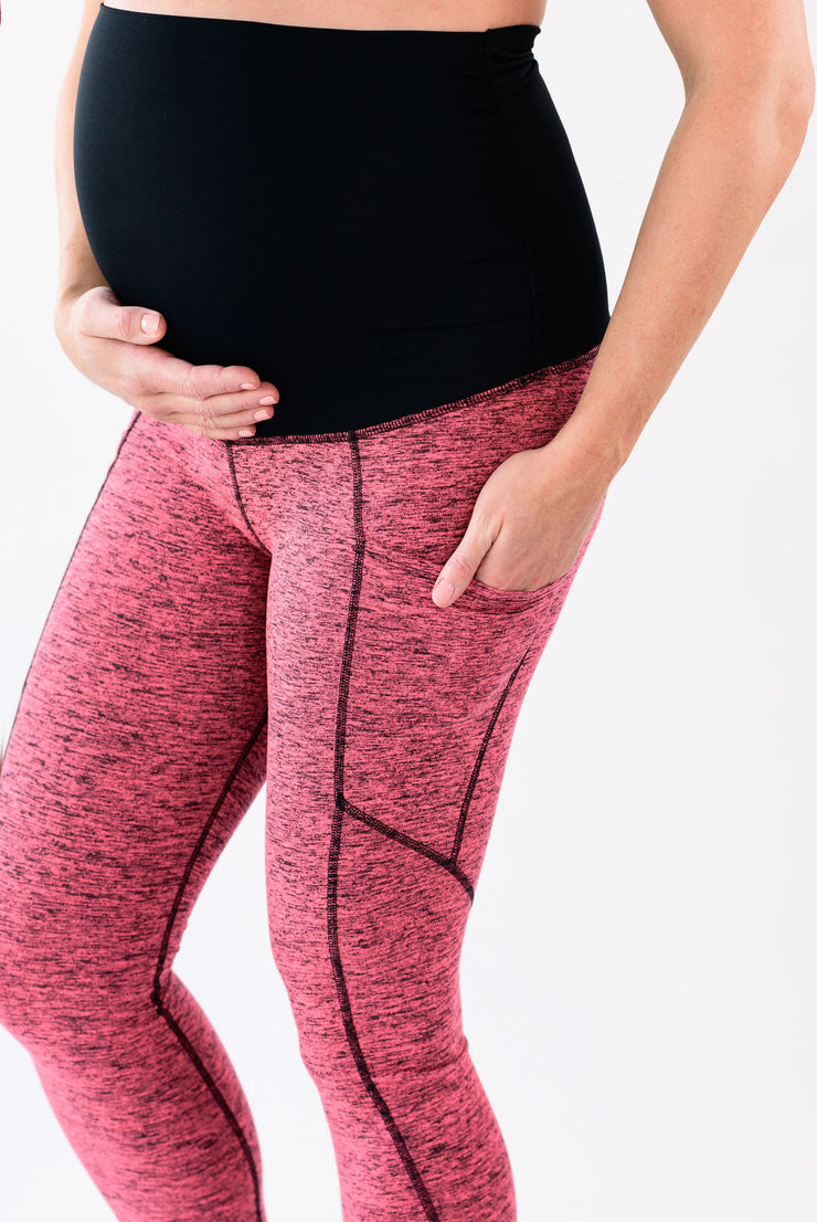 Our over-the-belly maternity leggings with pockets gives bump coverage and extra- support for working out in comfortable stretch fabric in peppered pink.