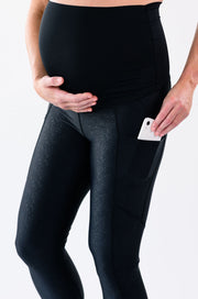 Our over-the-belly maternity leggings with pockets gives bump coverage and extra- support for working out in comfortable stretch fabric in speckled black.