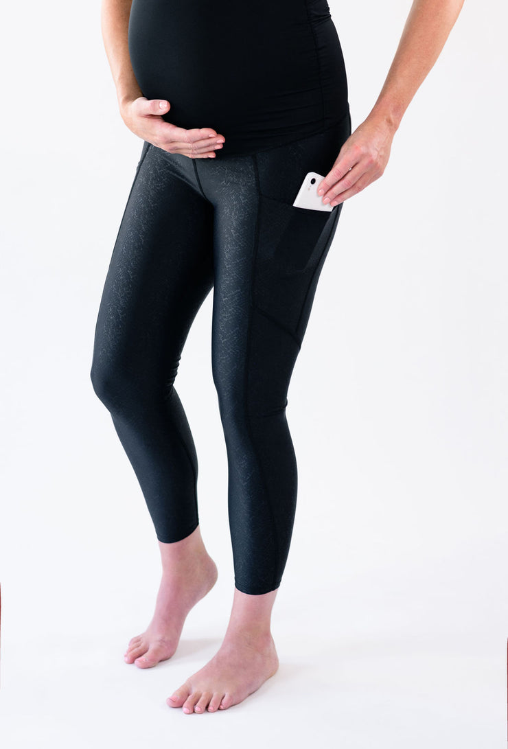 Our over-the-belly maternity leggings with pockets gives bump coverage and extra- support for working out in comfortable stretch fabric in speckled black.